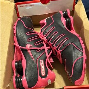 Nike Black and Pink Athletic Shoes with Sporty Design